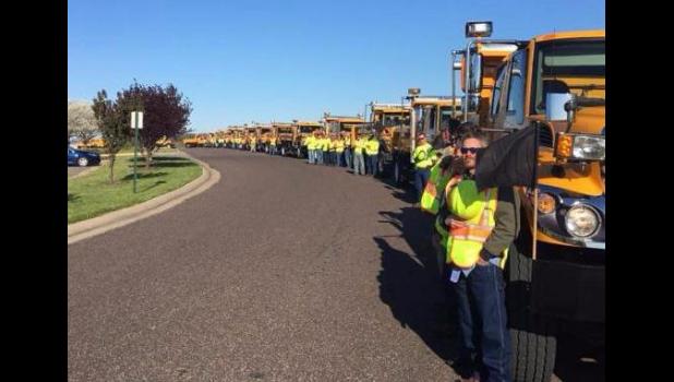 Co-workers of fallen worker Lyndon D. Ebker pay tribute on the day of his funeral.
